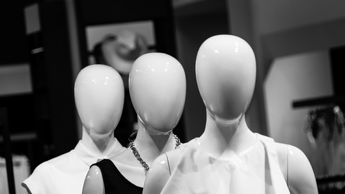Image of some faceless mannequins
